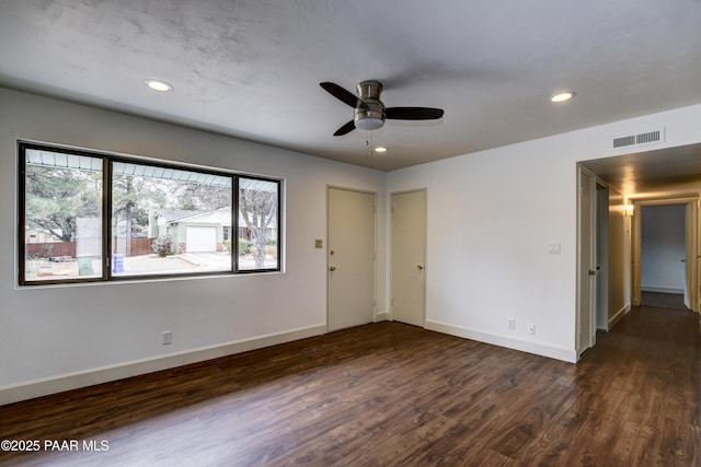 unfurnished room featuring baseboards, visible vents, a ceiling fan, dark wood-style floors, and recessed lighting