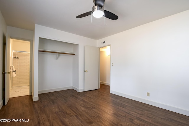 unfurnished bedroom featuring a ceiling fan, visible vents, baseboards, a closet, and dark wood finished floors