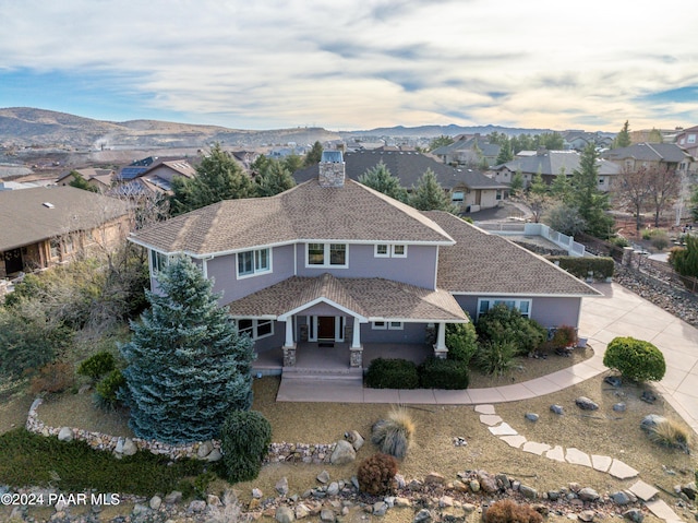 drone / aerial view featuring a mountain view