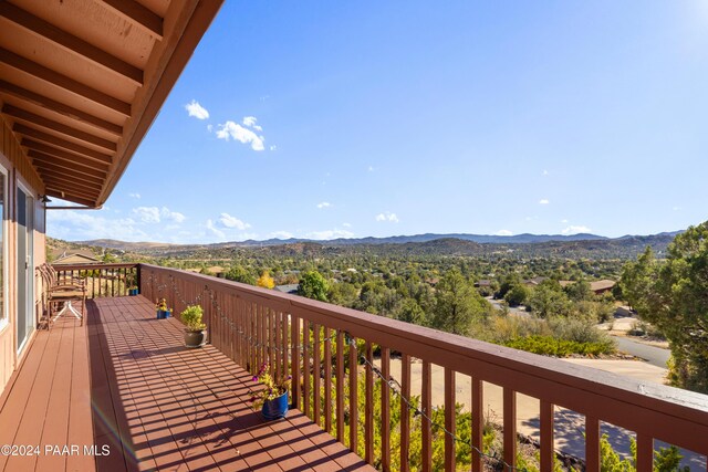 wooden deck with a mountain view