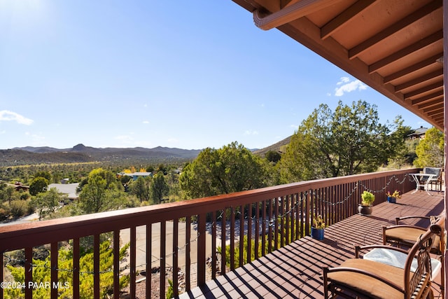 wooden terrace with a mountain view