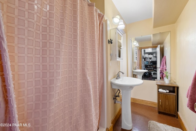 bathroom with sink and walk in shower