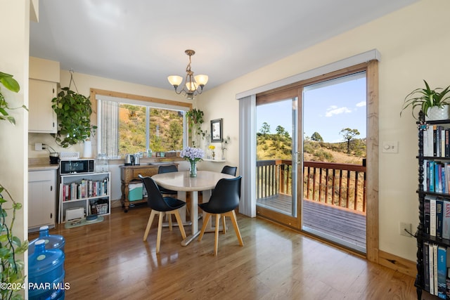 dining space featuring a chandelier and hardwood / wood-style floors