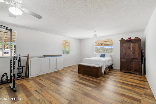 8910 S Steven Trl, Kirkland, AZ 86332 - bedroom featuring wood-type flooring, a textured ceiling, and ceiling fan