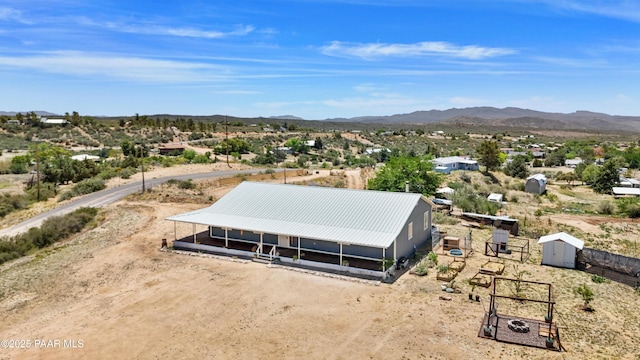 8910 S Steven Trl, Kirkland, AZ 86332 - aerial view of property and surrounding area featuring a mountain backdrop and a desert landscape