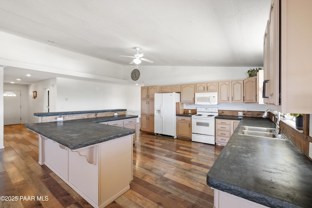 8910 S Steven Trl, Kirkland, AZ 86332 - kitchen featuring white appliances, a sink, dark wood-style flooring, dark countertops, and lofted ceiling