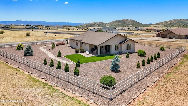 12612 E E Side Saddle Ln, Prescott Valley, AZ 86315 - ranch-style house with a fenced backyard, stucco siding, a mountain view, and driveway