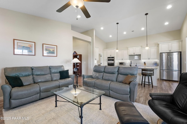 12612 E E Side Saddle Ln, Prescott Valley, AZ 86315 - living area featuring light wood-style flooring, a ceiling fan, recessed lighting, and high vaulted ceiling