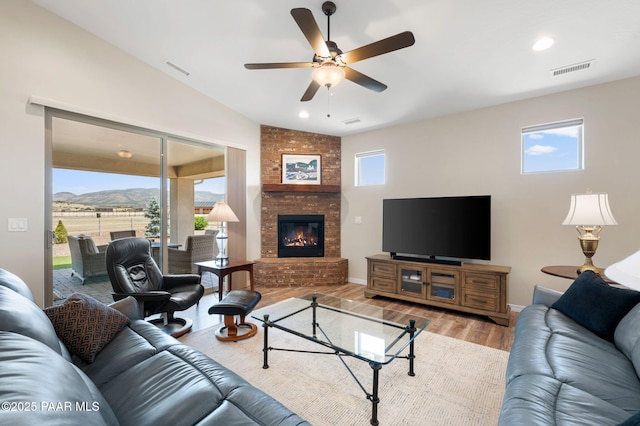 12612 E E Side Saddle Ln, Prescott Valley, AZ 86315 - living area with wood finished floors, ceiling fan, a fireplace, and recessed lighting