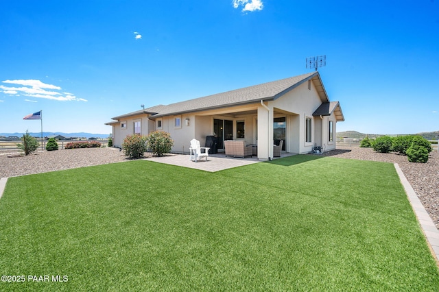 12612 E E Side Saddle Ln, Prescott Valley, AZ 86315 - back of property with a patio, stucco siding, and a lawn