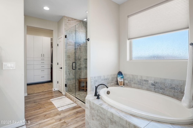12612 E E Side Saddle Ln, Prescott Valley, AZ 86315 - bathroom with a bath, a shower stall, wood finished floors, and recessed lighting