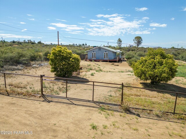 7555 W Wexford Dr, Wilhoit, AZ 86332 - view of yard with a rural view and a wooden deck