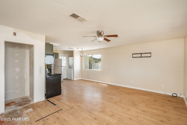 7555 W Wexford Dr, Wilhoit, AZ 86332 - unfurnished living room featuring a ceiling fan and light wood finished floors