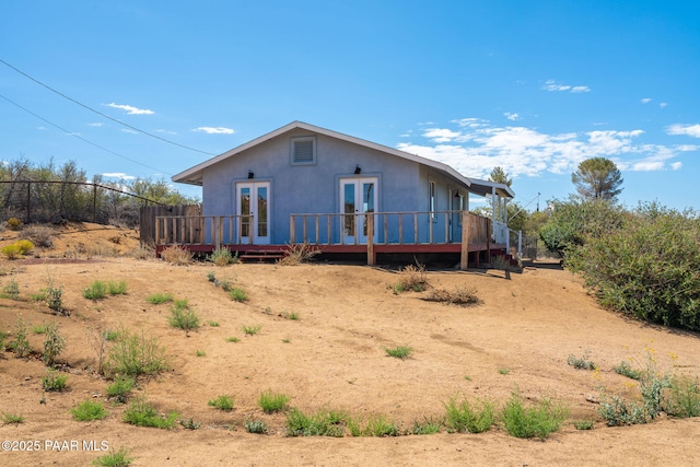 7555 W Wexford Dr, Wilhoit, AZ 86332 - back of property featuring french doors, a deck, and stucco siding
