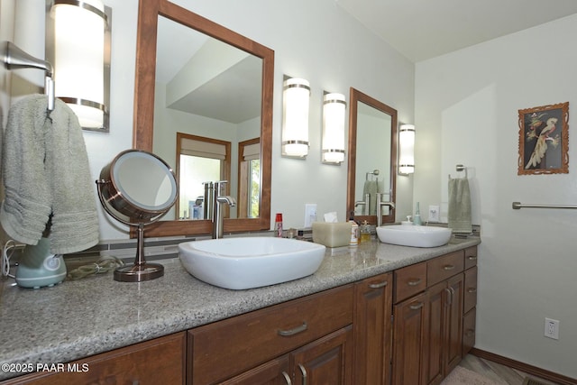 1255 Solar Heights Dr, Prescott, AZ 86303 - full bathroom featuring a sink, double vanity, and baseboards