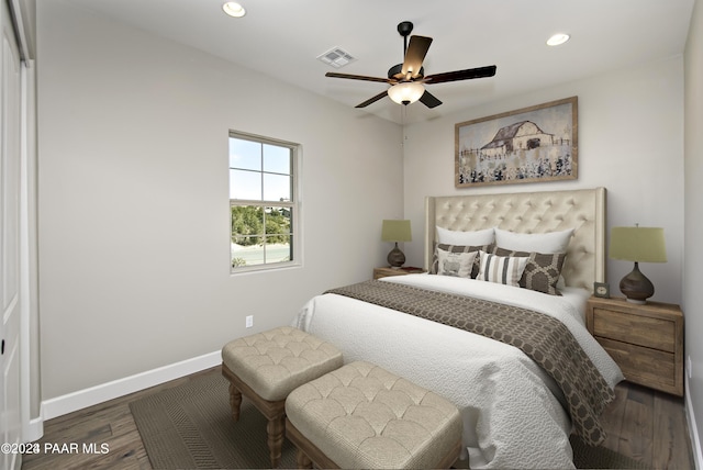 bedroom featuring ceiling fan and dark hardwood / wood-style flooring