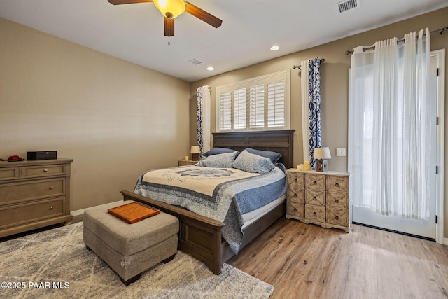 bedroom with wood finished floors, ceiling fan, and recessed lighting