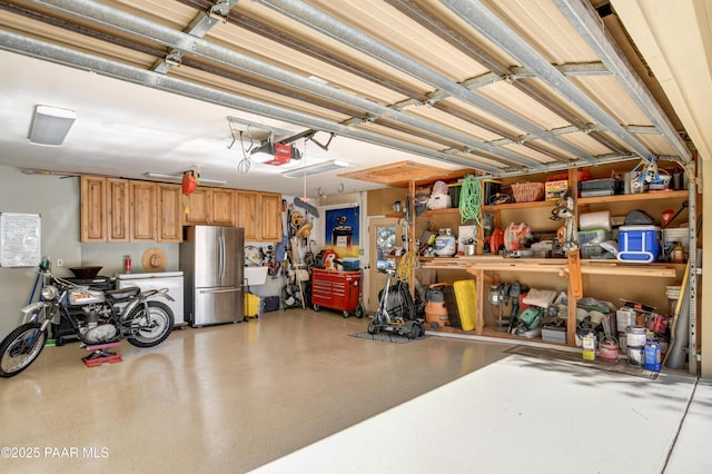 garage with freestanding refrigerator and a garage door opener