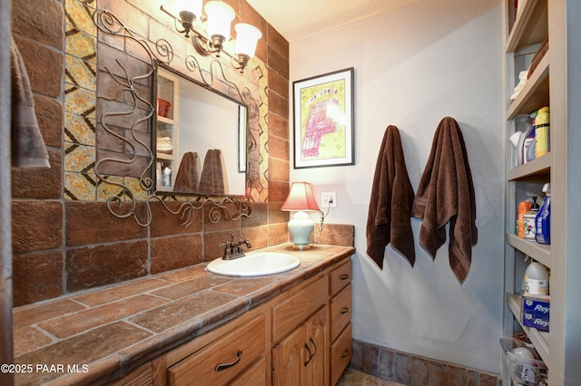 bathroom with tasteful backsplash and vanity