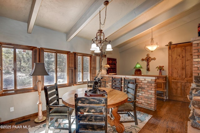 dining room featuring a wealth of natural light, visible vents, lofted ceiling with beams, and wood finished floors