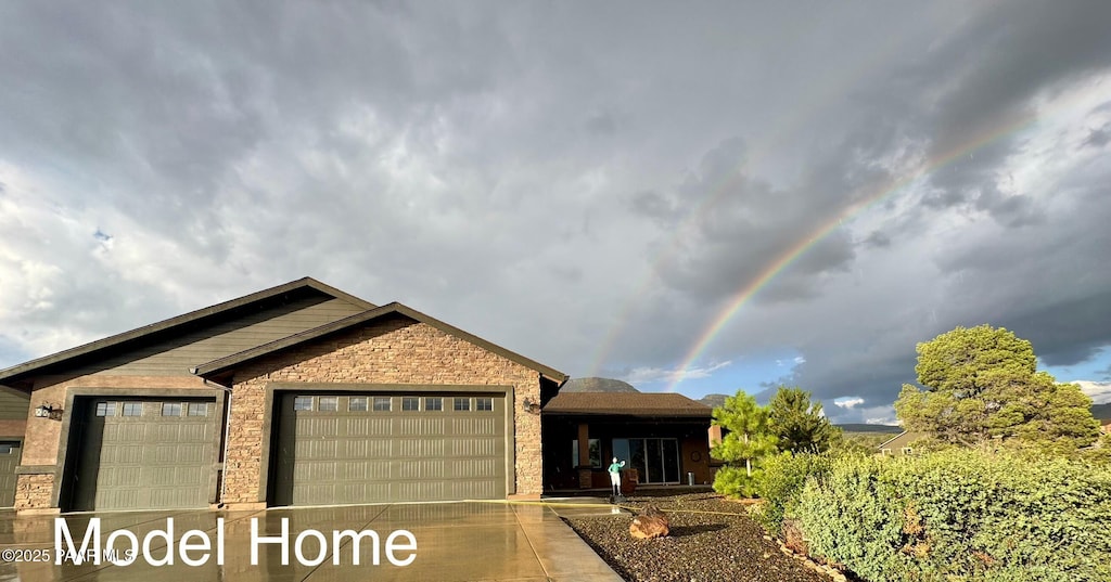 6648 E Copperfield Dr, Prescott Valley, AZ 86315 - single story home featuring an attached garage, stone siding, and concrete driveway