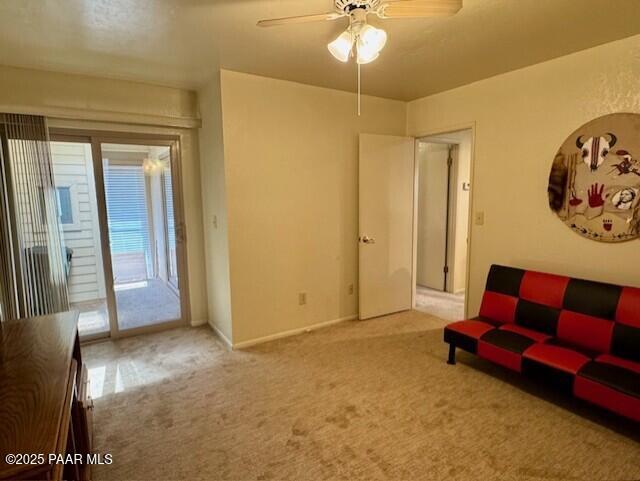 3169 Dome Rock Pl Unit 12A, Prescott, AZ 86301 - living room with carpet floors and a ceiling fan