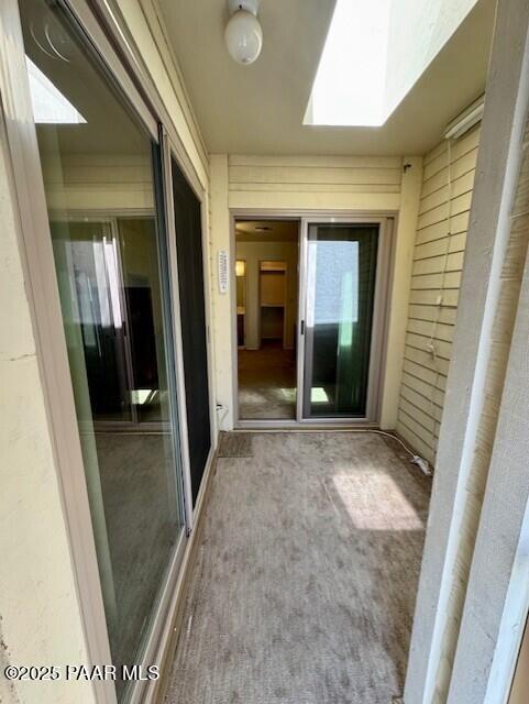 3169 Dome Rock Pl Unit 12A, Prescott, AZ 86301 - unfurnished sunroom featuring a skylight