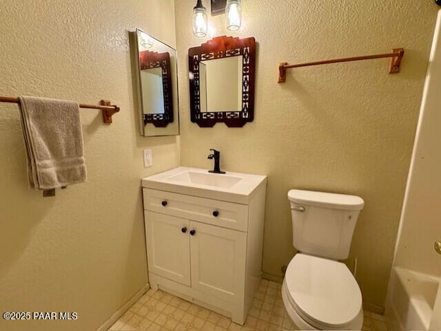 3169 Dome Rock Pl Unit 12A, Prescott, AZ 86301 - full bath with vanity, toilet, tile patterned floors, a tub, and a textured wall