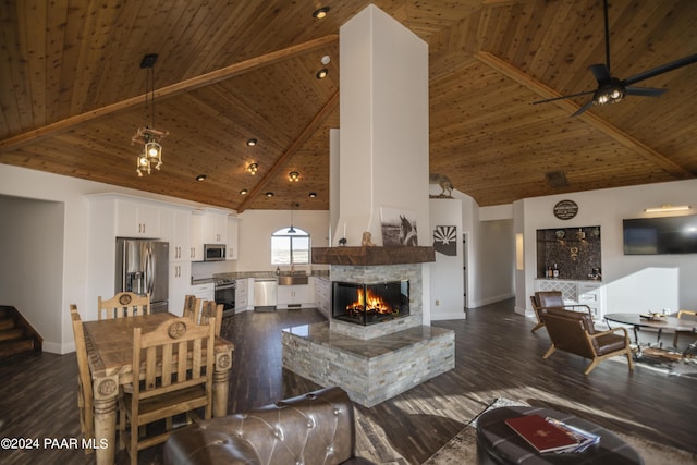 living room with wooden ceiling, high vaulted ceiling, a multi sided fireplace, ceiling fan, and dark hardwood / wood-style flooring