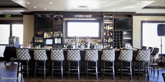 bar featuring dark parquet floors