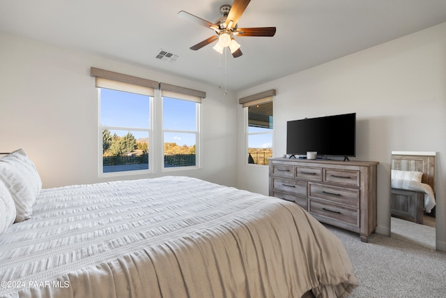 carpeted bedroom featuring ceiling fan