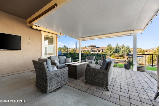 view of patio / terrace featuring an outdoor living space with a fire pit