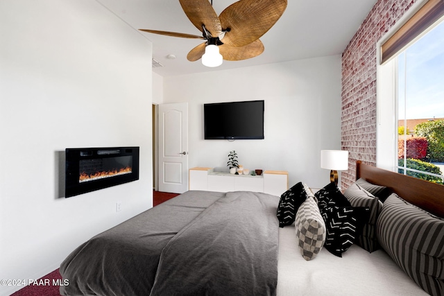 bedroom with carpet flooring, multiple windows, and ceiling fan