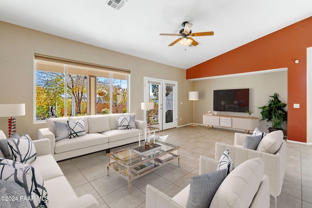 living room featuring light tile patterned floors, ceiling fan, and lofted ceiling