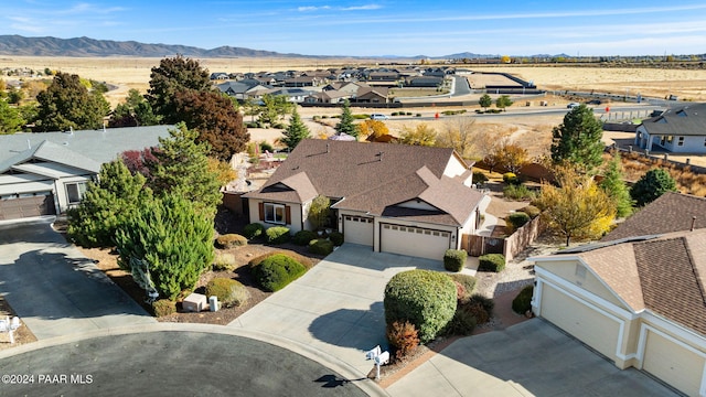 birds eye view of property featuring a mountain view