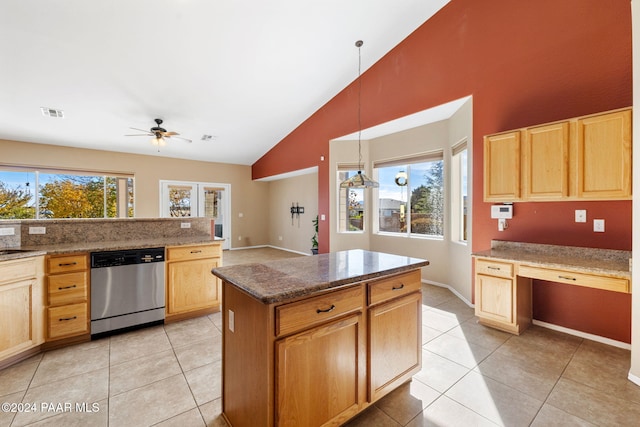 kitchen featuring stainless steel dishwasher, ceiling fan, pendant lighting, light tile patterned floors, and lofted ceiling