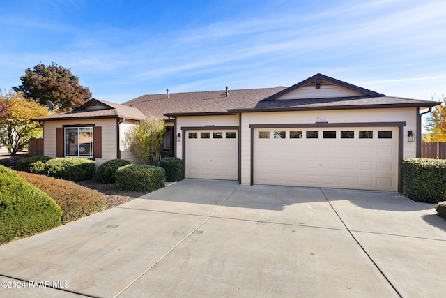 ranch-style house featuring a garage