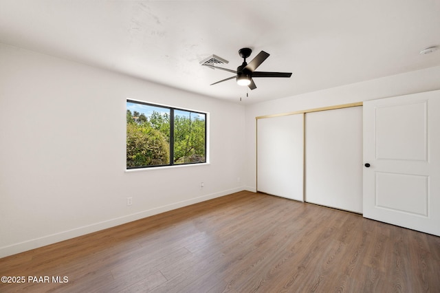 679 Tawa Ct, Prescott, AZ 86301 - unfurnished bedroom with baseboards, wood finished floors, a closet, and ceiling fan