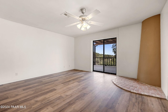 unfurnished room with hardwood / wood-style flooring and ceiling fan