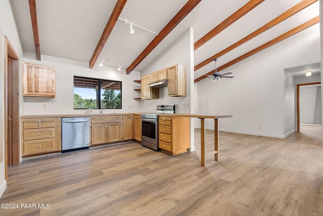 kitchen featuring light wood-type flooring, kitchen peninsula, appliances with stainless steel finishes, and light brown cabinetry