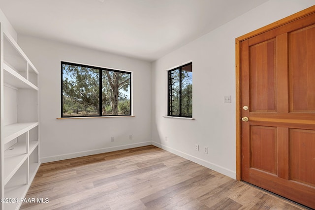 spare room featuring light hardwood / wood-style floors