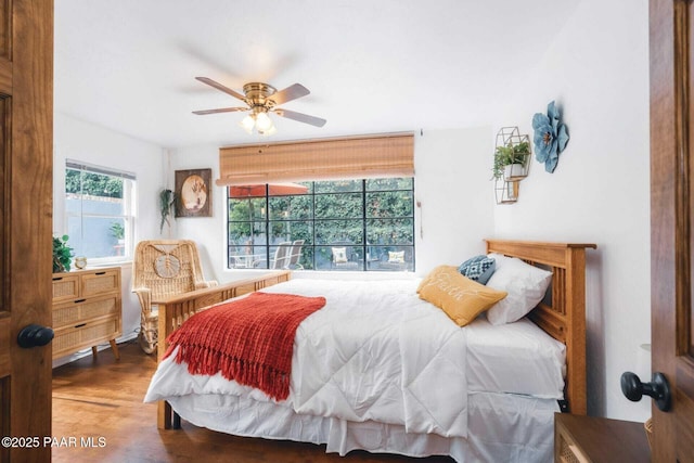 bedroom with ceiling fan and wood finished floors