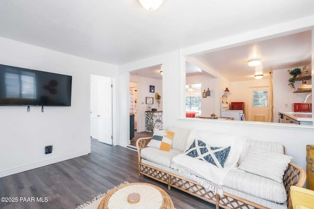 living room featuring baseboards and wood finished floors