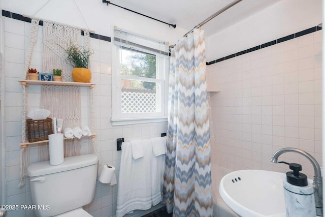 full bath featuring toilet, tile walls, and a shower with curtain