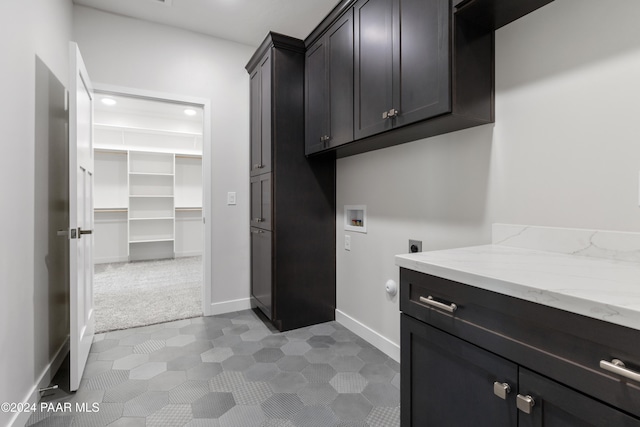 washroom with baseboards, recessed lighting, hookup for a washing machine, cabinet space, and electric dryer hookup