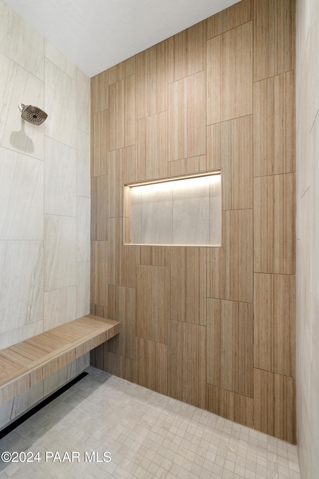 bathroom with a sauna and tiled shower
