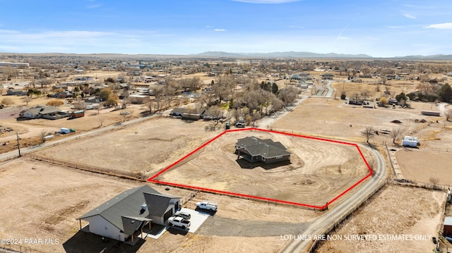 birds eye view of property with a rural view, a desert view, and a mountain view