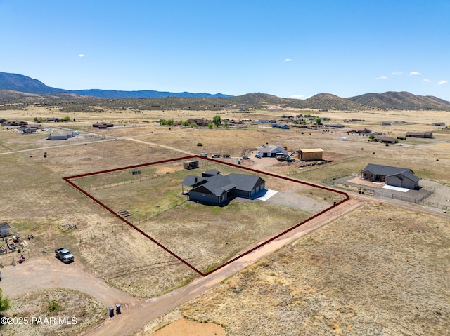 overview of rural landscape with property boundaries highlighted and a mountainous background