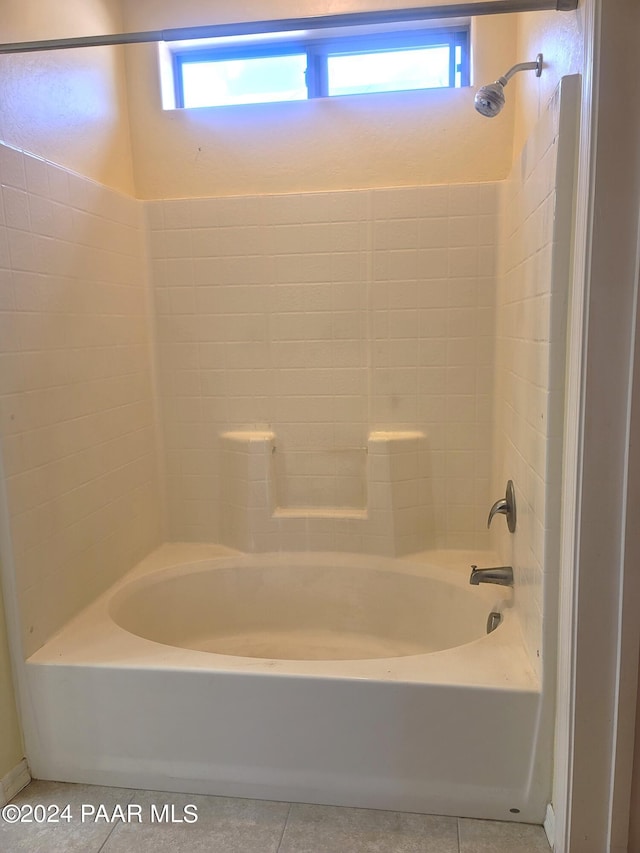 bathroom with plenty of natural light, shower / bath combination, and tile patterned flooring