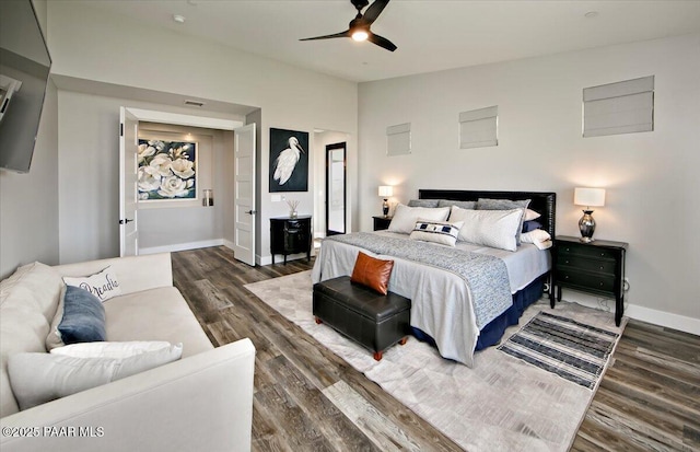 bedroom with baseboards, visible vents, a ceiling fan, and dark wood-type flooring